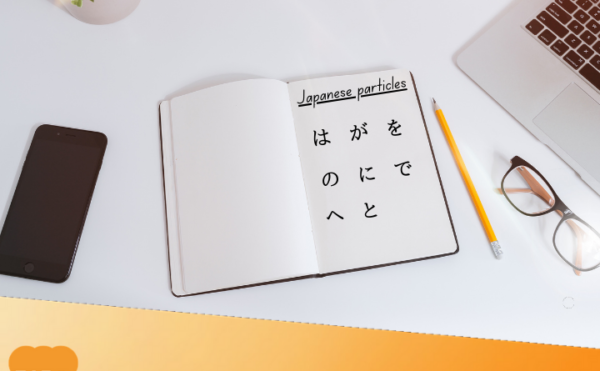 Learning Japanese particles, writing on the notebook