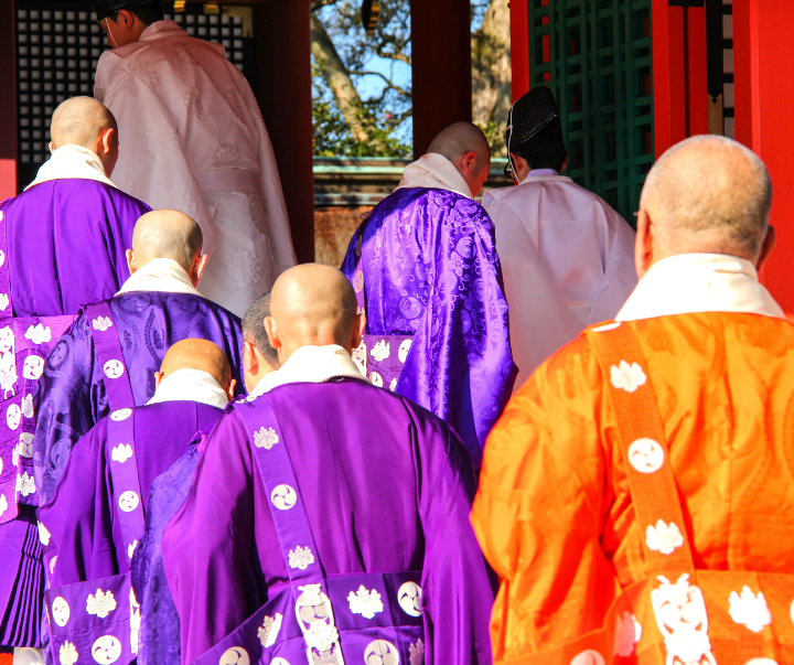 Buddhist monk and Shinto priests together.