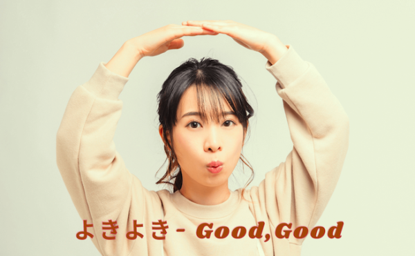 A girl making an expression of "Yoki" meaning good, good